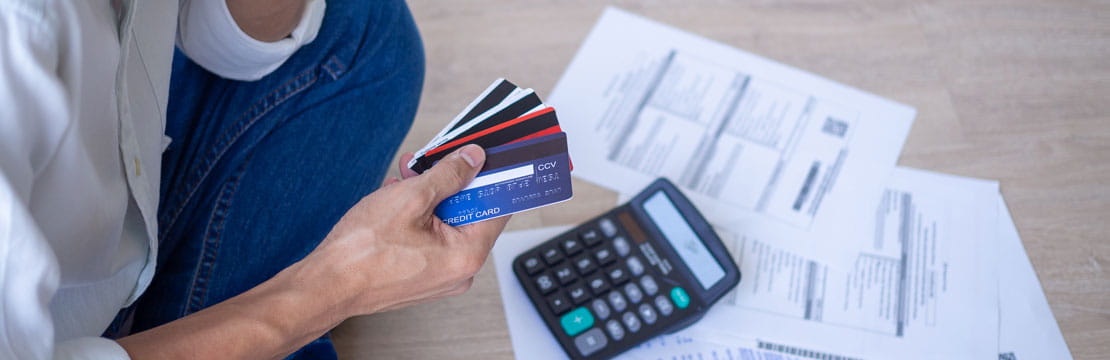 Business men sitting stressed out with home expenses and monthly credit card debt.